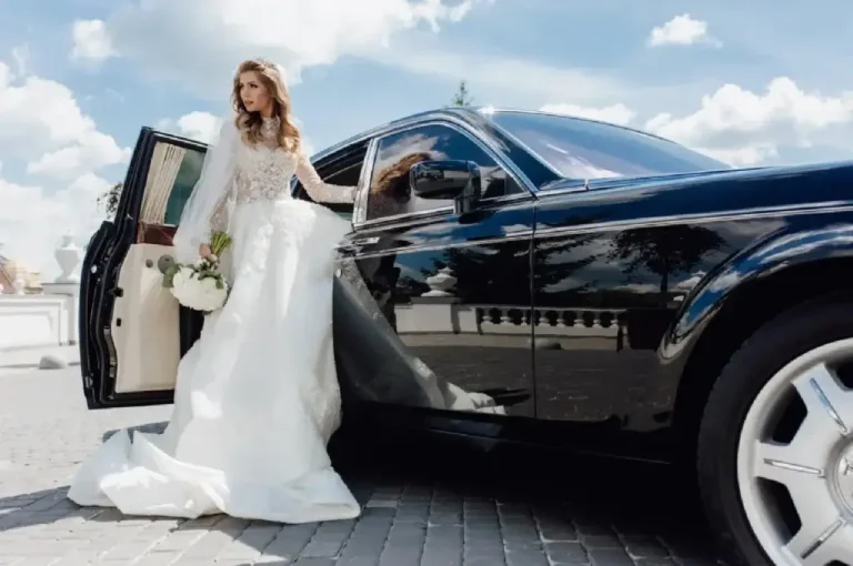 Bride stepping out of a luxury black wedding limo car, showcasing premium wedding transportation service.